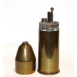 A Boer War trench art table top petrol lighter made from a period brass shell case. Stamped to the