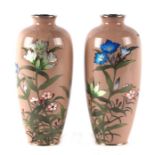 A pair of Japanese cloisonne vases decorated with flowers on a pink ground with three character mark