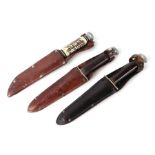 A William Rogers "I Cut My Way" commando knife in its leather scabbard 14cms (5.5ins) blade,