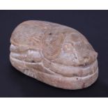 An Egyptian hardstone heart scarab seal, 9cms long.