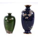 A Japanese cloisonne vases decorated with prunus on a blue ground, 17cms high; together with another