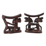 African / Tribal Art. Two hardwood neck rests, one a pair of figures, one a figure riding an