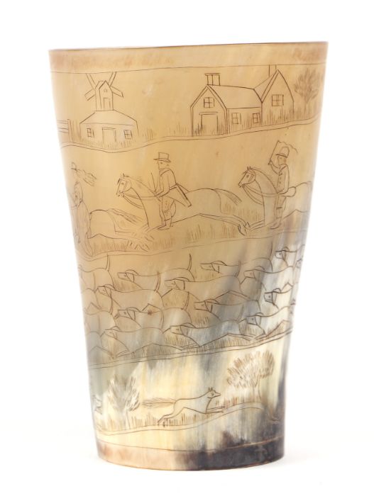 A horn beaker decorated with a fox hunting scene, 14cms high.Condition ReportNo chips or cracks