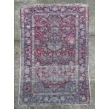 A Turkish Hereke silk rug with foliate design within floral borders, 205 by 121cms.