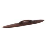 An Australian Aboriginal carved hardwood shield, 59cms long.