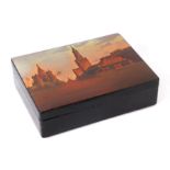 A Russian lacquer table-top box, the top decorated with a scene of St Basil Cathedral, Moscow,