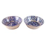 An Turkish Iznik pottery bowl with traditional blue bird decoration, 27cms diameter; together with