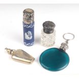 A group of four miniature scent bottles to include silver topped Victorian examples and a Russian