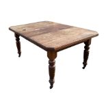 A late 19th century walnut extending dining table with one extra leaf, the rectangular top with