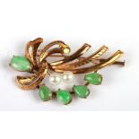 A 14ct gold jade and pearl mounted brooch.