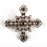 An early 19th century diamond and sapphire set cross brooch with gold mount and old cut stones in