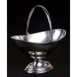 A silver swing handle sugar basket of navette form, Birmingham 1925 and makers mark for F C