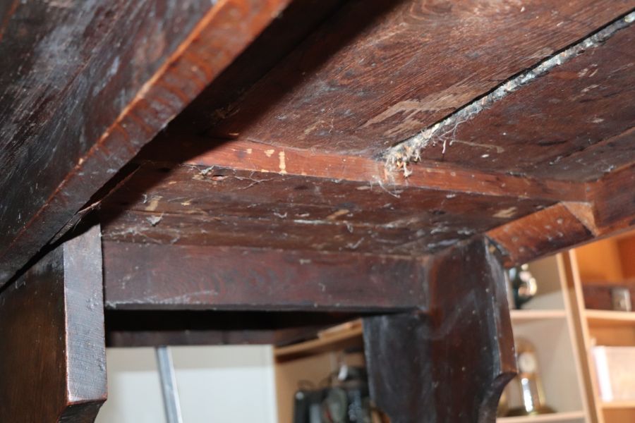 A large 17th century style oak refectory table with four plank top, on trestle supports joined by - Image 19 of 20