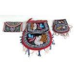 Three antique Native American Indian beadwork purses, the largest 18cms wide.