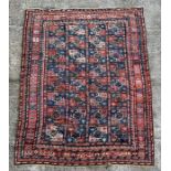 A West Turkmenistan Tekke rug with a field of aina kochak guls, 164 by 244cms.