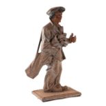 A vintage cast iron figure of a golfer with traces of cold painted decoration, 39cms high.