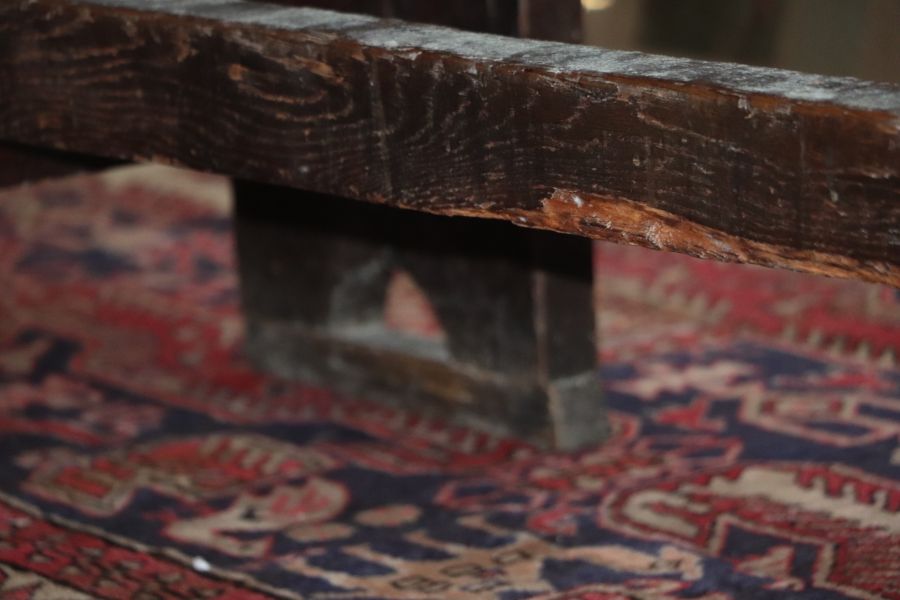 A large 17th century style oak refectory table with four plank top, on trestle supports joined by - Image 9 of 20