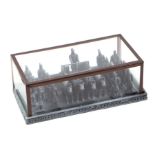 A small diorama of the Chinese Terracotta Army in a glazed display case, 18cms wide.