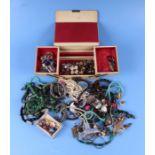 A quantity of costume jewellery to include necklaces, brooches and clip earrings.