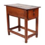 A 19th century stained pine side table with single end drawer, on square legs joined by