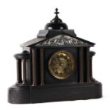 A Victorian black slate mantle clock of architectural form, the brass dial with Arabic numerals.