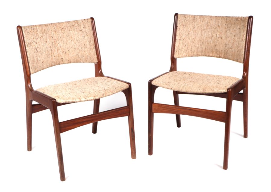 A pair of mid century teak dining chairs with padded backs and seats (2).