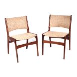 A pair of mid century teak dining chairs with padded backs and seats (2).