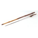 A bamboo shafted sword stick with a stag horn handle and having a 56.5cms (22.25ins) square