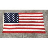 A United States Stars & Stripes flag with 50 stars, approx 112 by 206cms.