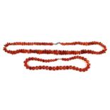 A graduated faceted amber bead necklace; together with a graduated amber pebble bead necklace, total
