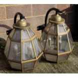 A pair of large outdoor wall lamps of octagonal form, on metal brackets, 76cms high (2).Condition