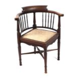 An Edwardian mahogany corner chair with boxwood stringing.