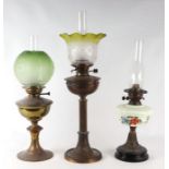 A group of oil lamps to include a Corinthian column type example (3).Condition ReportAll shades in