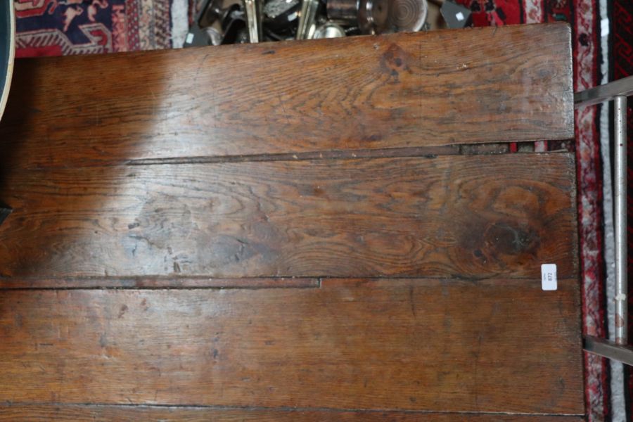 A large 17th century style oak refectory table with four plank top, on trestle supports joined by - Image 12 of 20