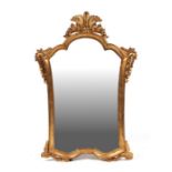 A Florentine style giltwood wall mirror, overall 52 by 76cms.