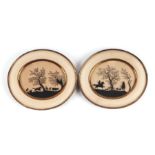 A pair of paper silhouette cut pictures depicting hunting scenes, glazed and in brass oval frames,