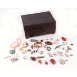 A quantity of silver, white metal and costume jewellery in a mahogany box.