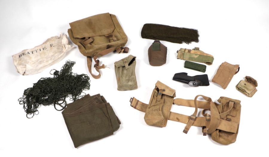 A quantity of assorted military webbing items to include haversacks, kit bags and other similar