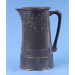 A David Veasey for Liberty & Co Tudric pewter jug of tapering cylindrical form decorated with