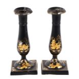 A pair of painted metal chinoiserie candlesticks, 19cms high (2).