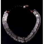 An ethnic tribal necklace comprising of over 300 Islamic silver based coins, possibly Yemeni or