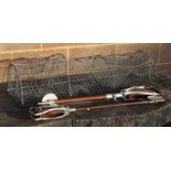 A wirework crayfish trap, 90cms long; together with two shooting sticks, both with leather seats (
