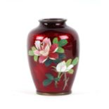 A Japanese Akasuke Ginbari cloisonne vase with pigeon blood ground, decorated with sprays of