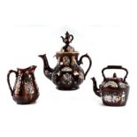 A Barge ware pottery teapot with plaque to 'Mrs Chappel 1891', 36cms high; together with a similar