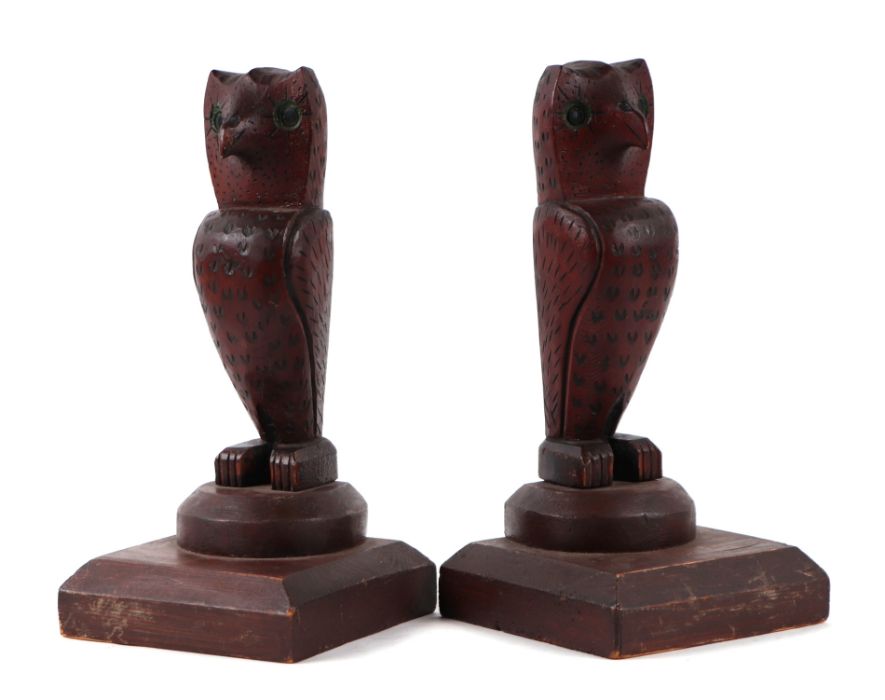 A pair of naïve folk art carved wooden owls, 25cms high.