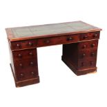 A late Victorian mahogany pedestal desk, the rectangular leather inset top above three frieze