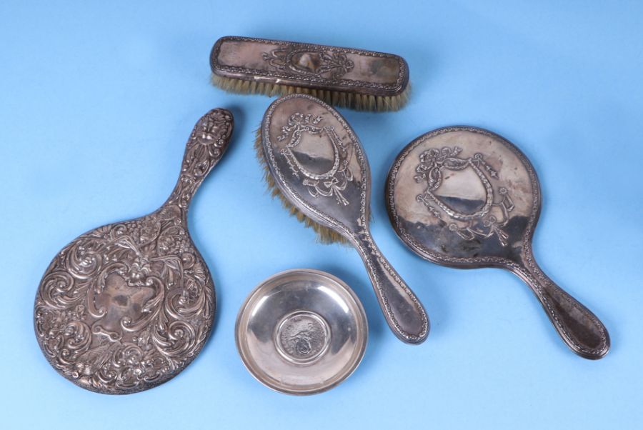 A quantity of silver backed dressing table items to include a hand mirror, Birmingham 1912; a