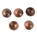 A set of five WW1 British army Brodie helmets made from English copper pennies, each coin dated