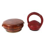 A Tibetan lacquered wooden food carrier, 33cms high; together with a lidded rice bowl, 43cms