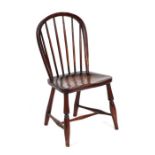 A child's hoop back Windsor type chair with solid elm seat, ring turned legs joined by an 'H'